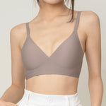 Chantelle's Secret Tri-Cup Daily Seamless Bra in a versatile taupe shade, featuring a soft v-neckline and slender straps for everyday elegance.