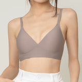 Chantelle's Secret Tri-Cup Daily Seamless Bra in a versatile taupe shade, featuring a soft v-neckline and slender straps for everyday elegance.