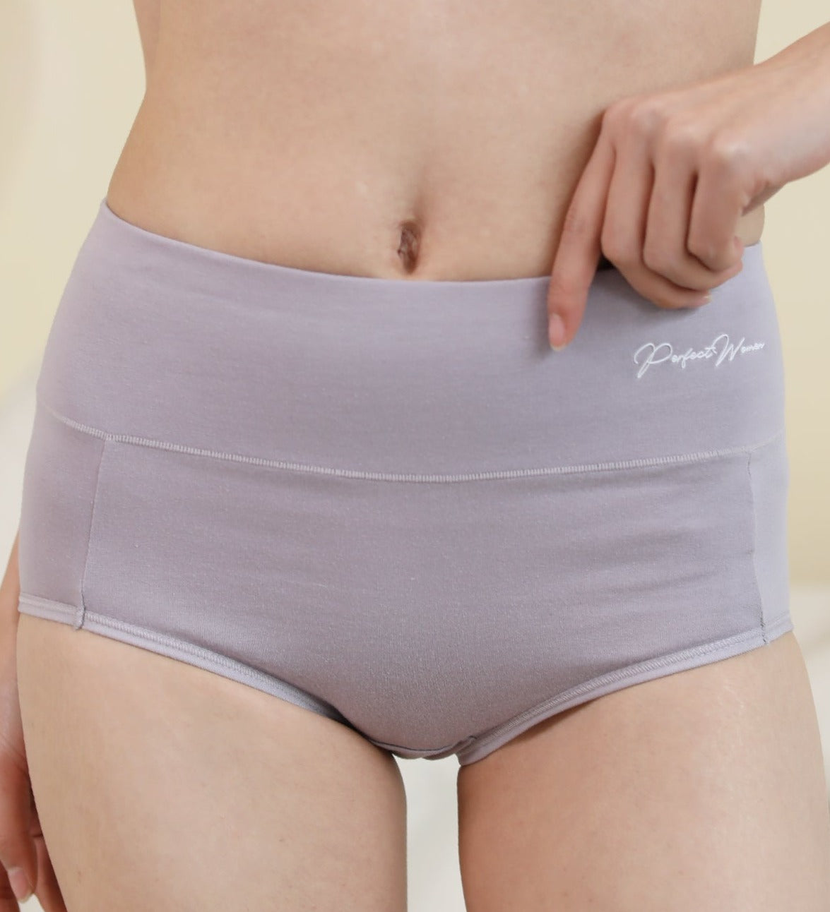 Model wearing Chantelle's Secret seamless cotton panties in purple, highlighting the smooth waistband and soft, stretchable fabric for a comfortable fit.
