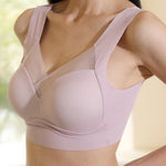 Side view of a model wearing Chantelle's Secret seamless sports bra in pink, highlighting the sleek and supportive design with adjustable straps for a personalized fit.